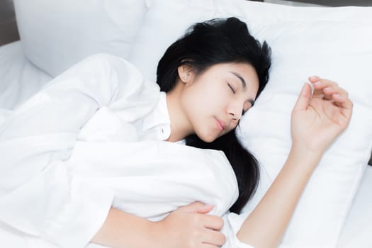 Happy young beauty women sleeping and smile on bed in the morning