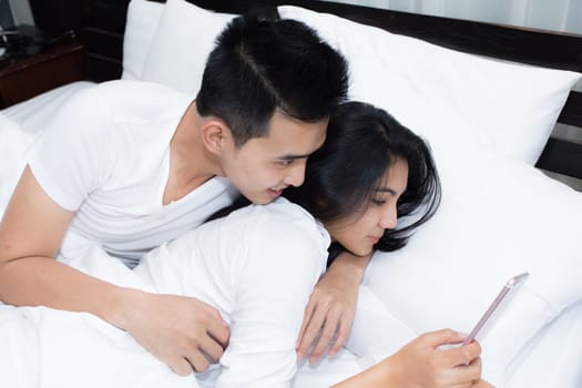 Unhappy couple having problems at bedroom in the morning