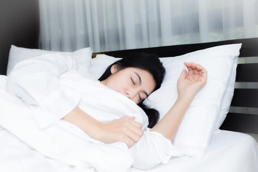 Happy young beauty women sleeping and smile on bed in the morning