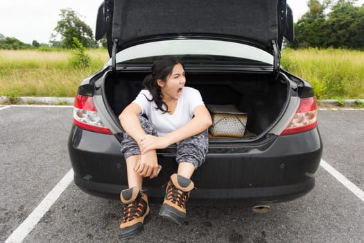 Woman opened the hood Broken car on the side See engines that are damaged or not