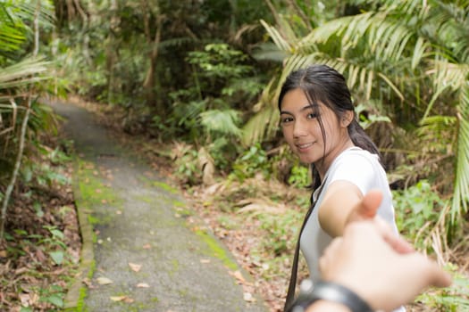 Beautiful smiling young asian woman enjoying yoga, relaxing, feeling alive, breathing fresh air, got freedom from work