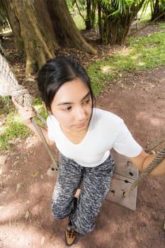 Beautiful smiling young asian woman enjoying yoga, relaxing, feeling alive, breathing fresh air, got freedom from work