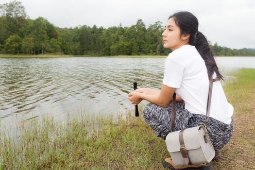 Beautiful smiling young asian woman enjoying yoga, relaxing, feeling alive, breathing fresh air, got freedom from work
