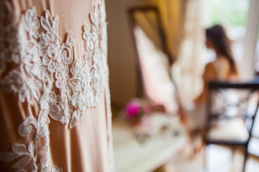 The bride and wedding dress at room