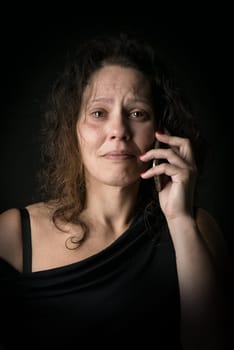 Scared woman calling for help, victim of domestic violence