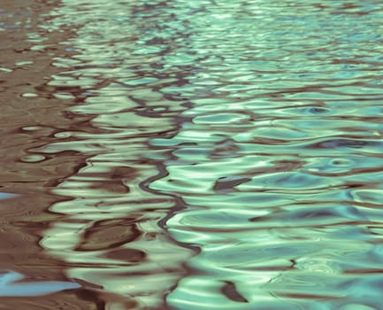 Blurred abstract background of light reflection on water motion