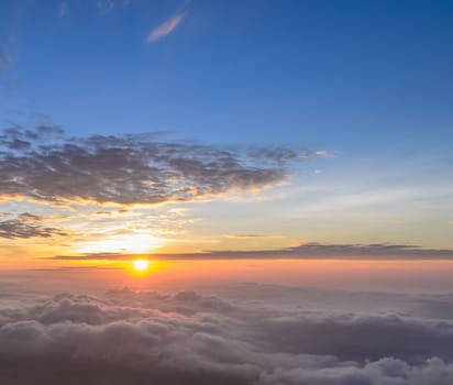 Beautiful nature landscape of rising sun in the early morning over sea of mist