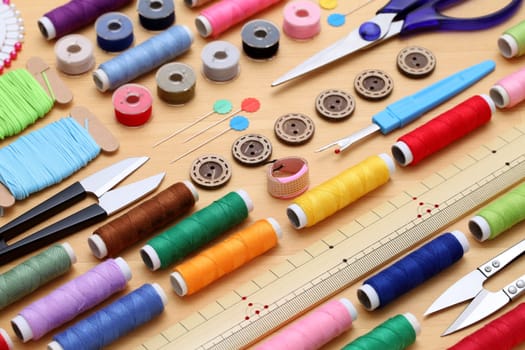 sewing tools, tailoring and fashion concept - close-up on wooden table
