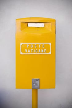 VATICAN CITY, VATICAN - OCTOBER 16, 2016: yellow post box on on piazza San Pietro in Rome, Italy