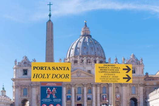 VATICAN CITY, VATICAN - OCTOBER 16, 2016: information shield in front of the piazza san pietro with the famous basilica st. peter