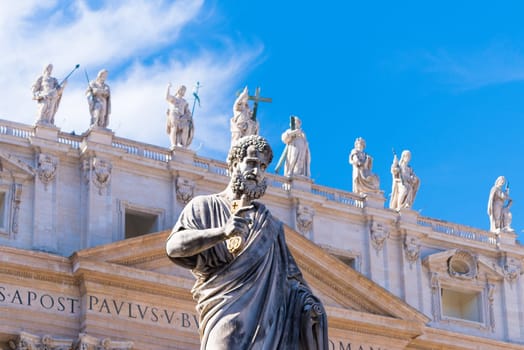 VATICAN CITY, VATICAN - OCTOBER 16, 2016: Statue Saint Peter in front of St Peter's Basilica on piazza San Pietro