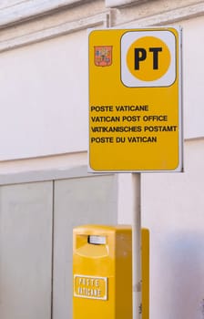 VATICAN CITY, VATICAN - OCTOBER 16, 2016: yellow post box on on piazza San Pietro in Rome, Italy