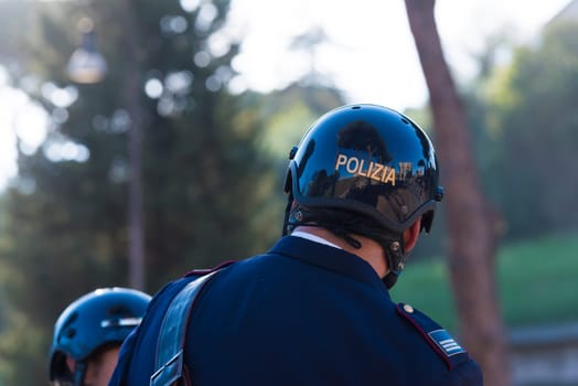 Two italian police men on horses at the collosseum