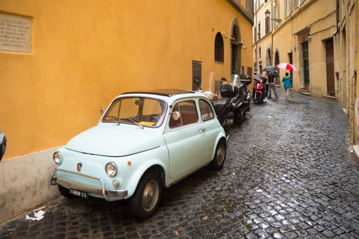 ROME, ITALY - OCTOBER 18, 2016: small vintage fiat 500 parked in the city center
