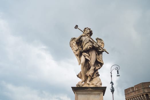 marble statue of an angel on a tiber bridge