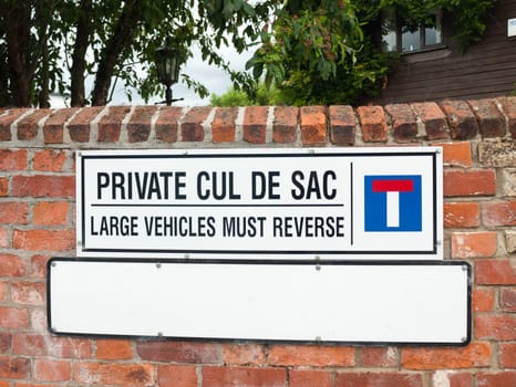 close up of private cul de sac sign on wall  UK