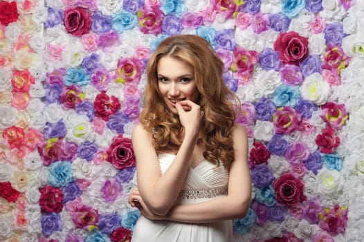 Portrait of young beautiful girl with wavy hair. Fashion photo