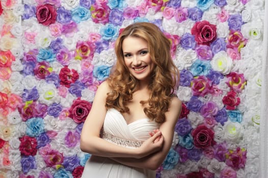 Portrait of young beautiful girl with wavy hair. Fashion photo