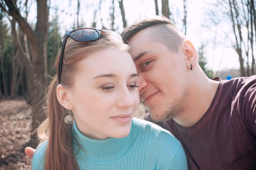 Attractive couple doing selfie outdoors. Concept love