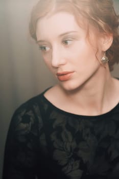 Elegant sexy woman on a dark background. portrait