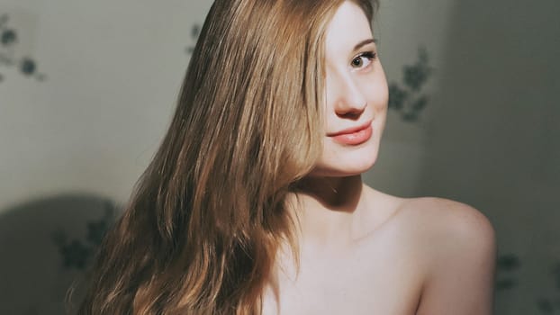Elegant sexy woman on a dark background. portrait