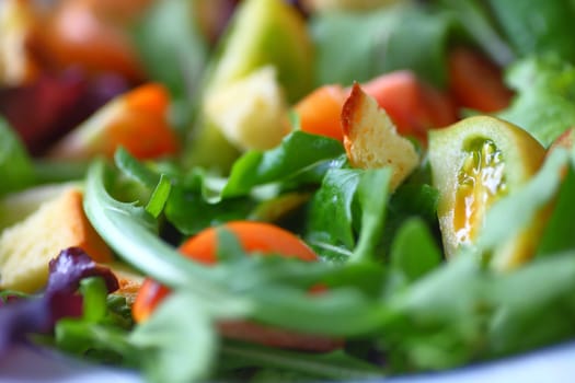 Salad of various lettuces and baby heirloom tomatoes with croutons