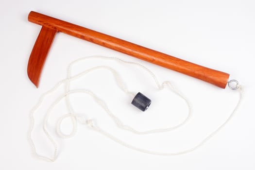 Wooden kusarigama, traditional Japanese weapon is on isolated white background.