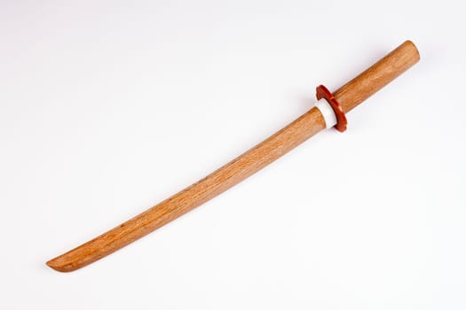 Japanese wooden short sword for training isolated on white background.