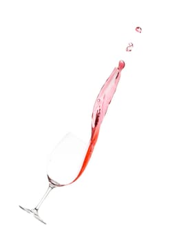 Red wine as a splash with wine glass as a crony in portrait format