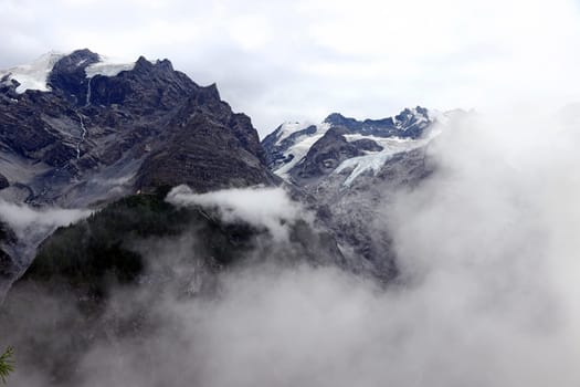 The Ortler with its glacier in the mountains of Italy. Dense fog on the Ortler in Italy. Thick fog in the mountains.