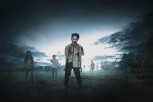 Crowd of aggressive asian zombies walking around on the spooky countryside
