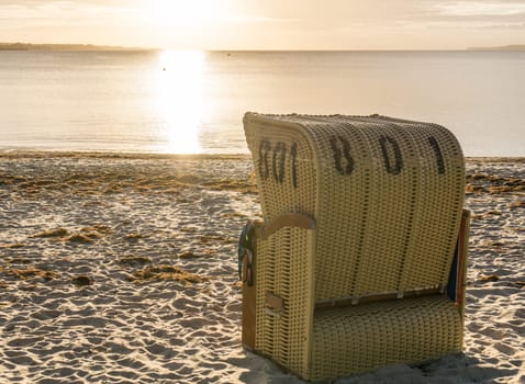 European Beach wicker chairs are placed decoratively on the beach for summer guests in the sun