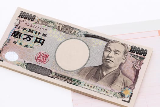 Japanese money and bankbook isolated on white background　