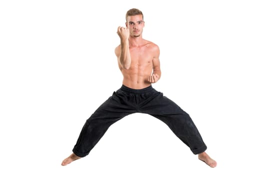 Martial arts student isolated in a white background