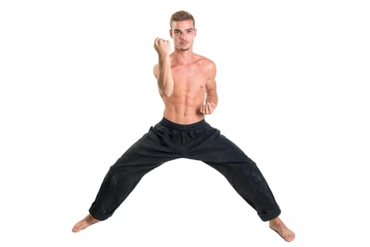 Martial arts student isolated in a white background