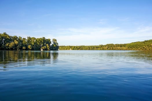 idyllic water landscape, lake with trees around