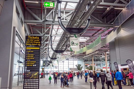 Nurburg, Germany - May 20, 2017: Race track Nurburgring, people in entrance hall - ticket info signboard in front