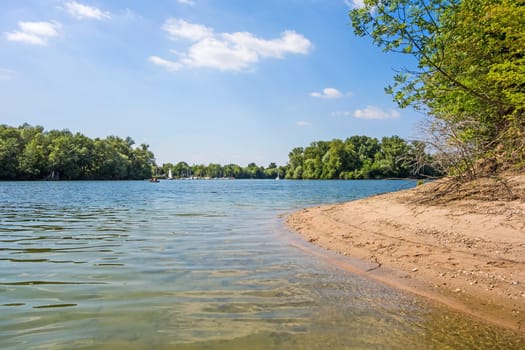 Kollerinsel Bruehl, view towards town Otterstadt, sandy beach aside