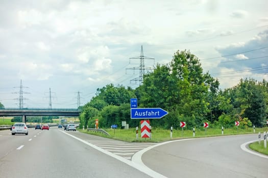 Pleideslheim, Germany - June 28, 2017: Highway exit (Ausfahrt) german motorway Autobahn A81 near town Pleidelsheim, direction to Stuttgart / Ludwigsburg city