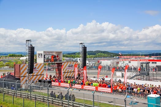 Nurburg, Germany - May 20, 2017: Fishermen's Friend Strongman RUN at race track Nurburgring - runners waiting for start on start finishing straight in front of stage