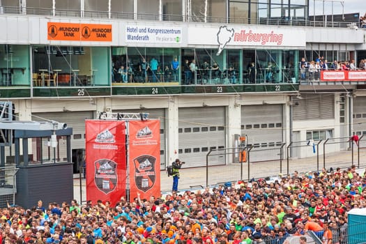 Nurburg, Germany - May 20, 2017: Fishermen's Friend Strongman RUN at race track Nurburgring - runners waiting for start on start finishing straight