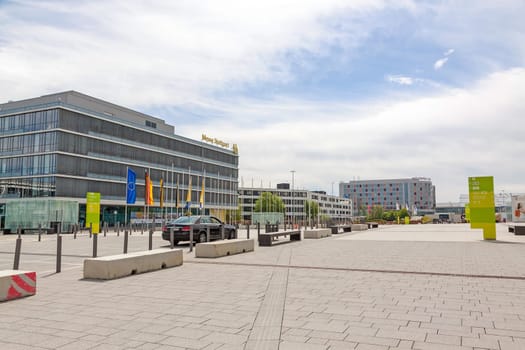 Stuttgart, Germany - May 06, 2017: Trade fair Stuttgart - administration building with corporate logo at building facade - square at entrance