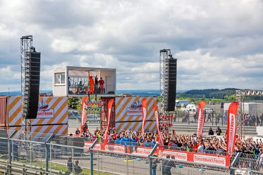 Nurburg, Germany - May 20, 2017: Fishermen's Friend Strongman RUN at race track Nurburgring - runners waiting for start on start finishing straight in front of stage