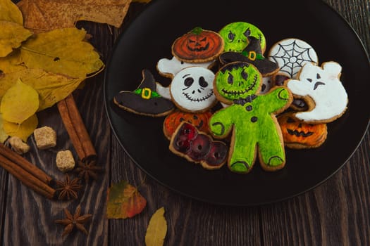 Delicious ginger cookies for Halloween on wooden table