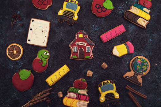 Back to school gingerbreads cookies on a dark background