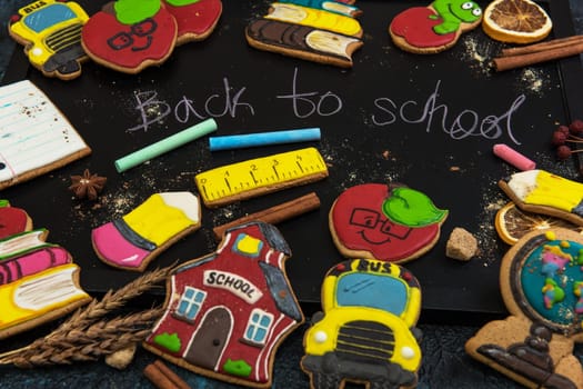 Back to school gingerbreads cookies on a dark background