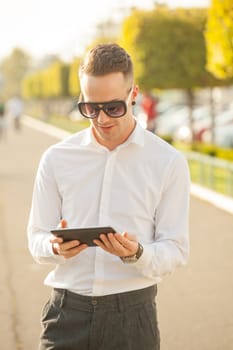Traveling Man With Mobile Phone And Hat, In City, Urban Space