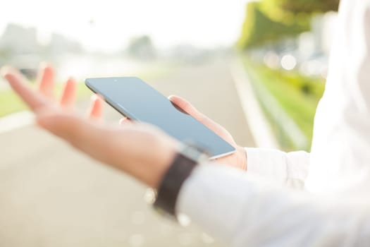 Close up of young man hands using touchscreen on digital tablet