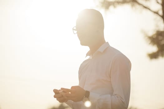 Man with glasses speak on mobile phone, In City, Urban Space, Park
