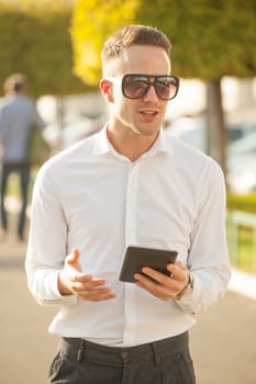 Traveling Man With Mobile Phone And Hat, In City, Urban Space